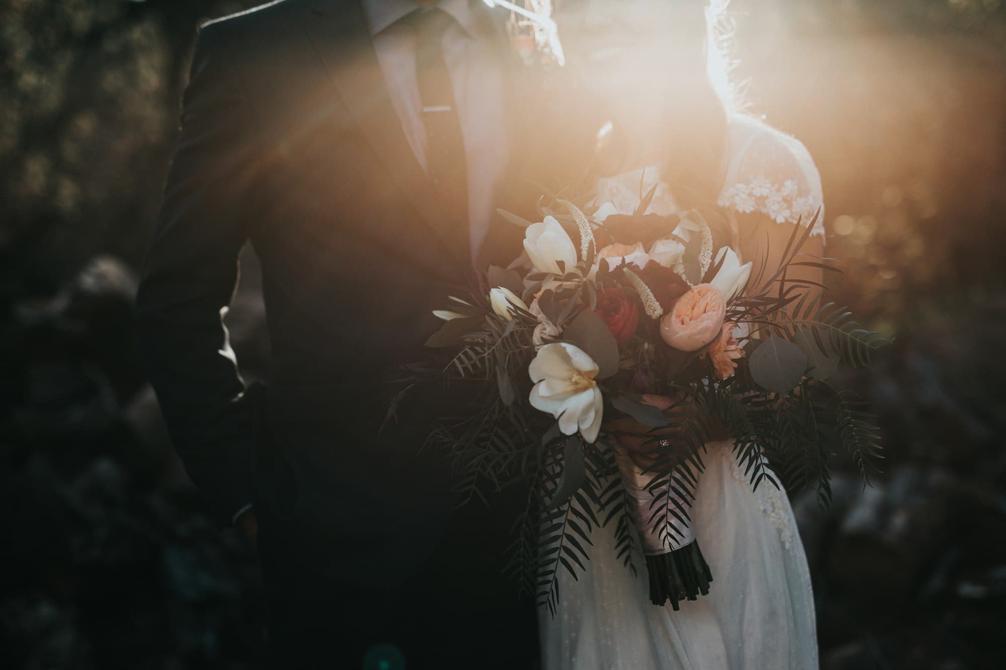 A bride and groom holding hands at the altar during their Christian wedding ceremony