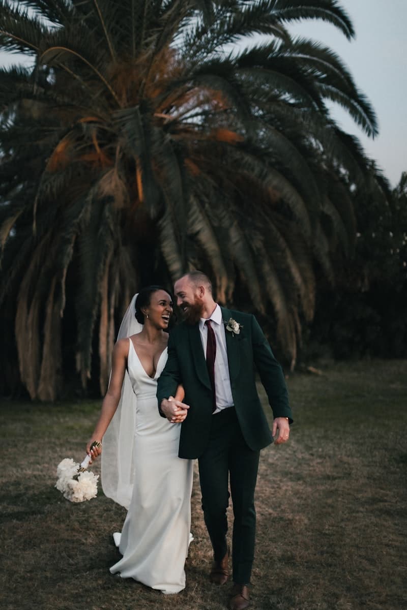 A wedding photographer capturing a couple during their celebration